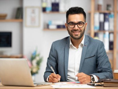 Portrait of a handsome young businessman working in an office